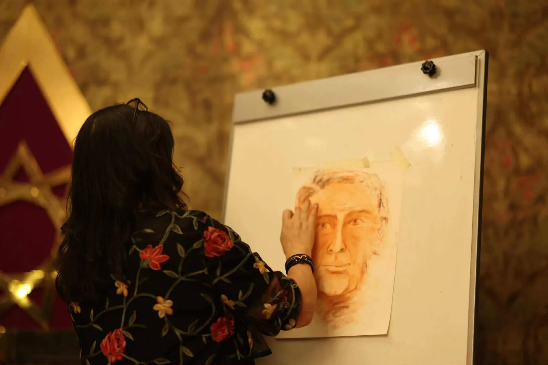 Mia Ottosson creating a spirit portrait at her easel